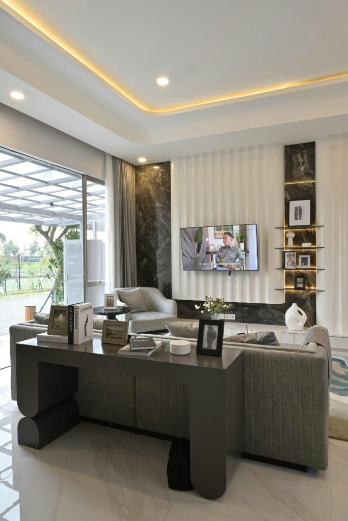 Interior of modern living room with TV on wall